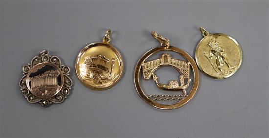 A yellow metal openwork pendant with bridge and gondola scene, an Acropolis pendant (both testing as 18ct) and two other pendants.